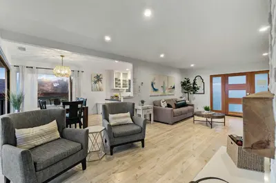 a living room with furniture and a dining room at The California - On Top of San Diego in a Hot Tub in San Diego