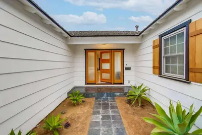 a front door of a home with white siding at The California - On Top of San Diego in a Hot Tub in San Diego