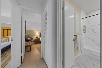 a bedroom with a bed and a room with a bathroom at No bad days in San Diego in San Diego