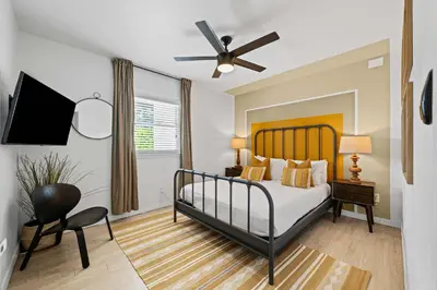 a bedroom with a bed and a ceiling fan at No bad days in San Diego in San Diego