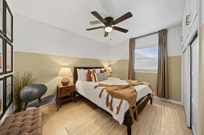 a bedroom with a bed and a ceiling fan at No bad days in San Diego in San Diego