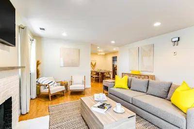 a living room with a couch and a fireplace at Canyon Cove Oceanside in Oceanside