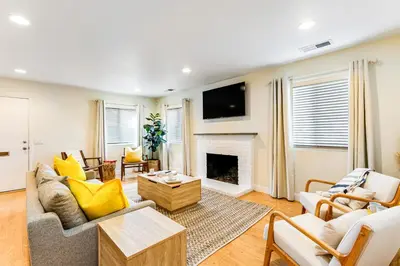 a living room with a couch and a fireplace at Canyon Cove Oceanside in Oceanside