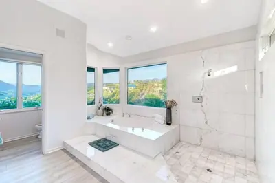 a white bathroom with a tub and a sink at Luxury Modern Chateau near wineries & beaches in Fallbrook