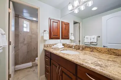 a bathroom with a sink and a shower at Buccaneer Beach Lookout - 30-Night Minimum in Oceanside