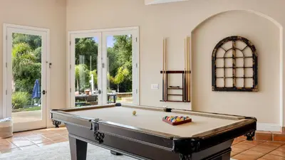a pool table in a living room with at Grapevine by AvantStay Secluded 5BR Villa 4 Acres of Vineyards Avo Groves in Temecula
