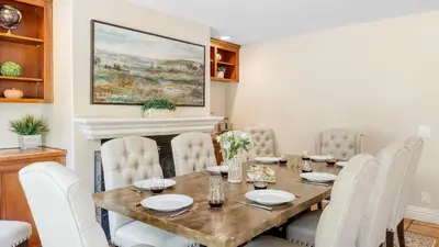 a dining room with a table and chairs at Grapevine by AvantStay Secluded 5BR Villa 4 Acres of Vineyards Avo Groves in Temecula
