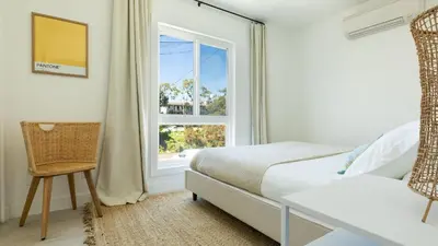 a bedroom with a bed and a window at Avalon Buyout by AvantStay Mins to Gaslamp Rooftop w BBQ Patio in San Diego