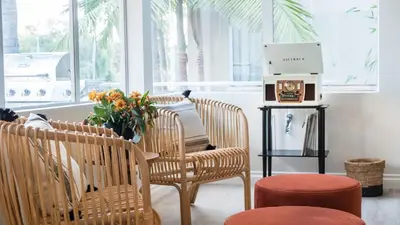 a room with chairs and a table with a laptop at Balboa Buyout by AvantStay - Condo w Views in DT San Diego in San Diego