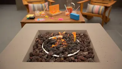 a table with a cake in the shape of a fire at Hamilton II by AvantStay Beach House Rooftop Deck Newly Renovated Bungalow in San Diego