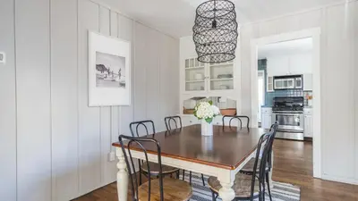 a dining room with a table and chairs at Topaz By AvantStay Adorable Cottage Walking Distance to Beach w Large Patio in San Diego