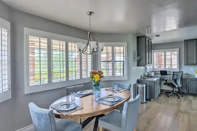 a dining room with a wooden table and chairs at Hilltop Hideaway in Temecula Wine Country in Sage