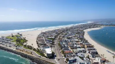 an aerial view of a beach with houses and the ocean at Mission Point 2 by AvantStay Mission Beach Home w Large Balcony Steps to Beach in San Diego