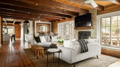 a living room with a couch and a fireplace at Chateau Syrah by AvantStay Picturesque Estate w Pool Hot Tub Table Tennis Pool Table New Pickleball Court Basketball hoop in Temecula