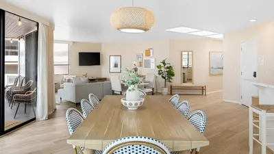 a dining room with a table and chairs at Beachfront Home w Ocean Views • Right on Mission Beach Belmont by AvantStay in San Diego