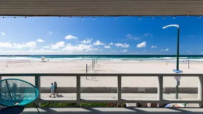 a view of the beach from the balcony of a beach at Beachfront Home w Ocean Views • Right on Mission Beach Belmont by AvantStay in San Diego