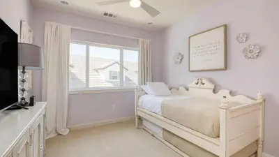 a white bedroom with a bed and a window at Grand Contento by AvantStay Extraordinary Estate w Pool Movie Room in Temecula