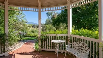 a gazebo with a table and chairs on a porch at Grand Contento by AvantStay Extraordinary Estate w Pool Movie Room in Temecula