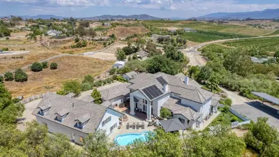 an aerial view of a house with a swimming pool at Grand Contento by AvantStay Extraordinary Estate w Pool Movie Room in Temecula