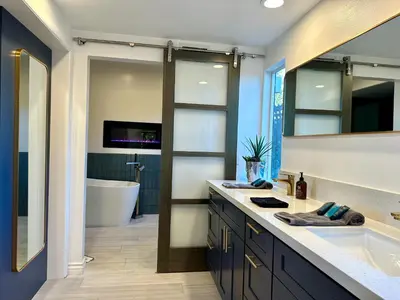 a bathroom with a tub and a sink and a bath room at Hilltop Villa, Pool Oasis, Pickleball Court, Avocado Grove, Views in Fallbrook