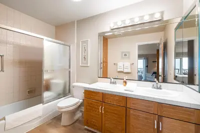 a bathroom with a toilet and a sink and a shower at Whitewater Village Retreat B in Oceanside