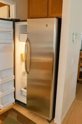 a refrigerator with its door open in a kitchen at Starlight Western Room in Hemet