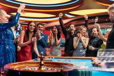 a group of people standing around a casino table at Starlight Western Room in Hemet
