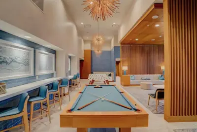a lobby with a ping pong table and chairs at Luxury Designer Suite with Rooftop Pool, Gym in San Diego
