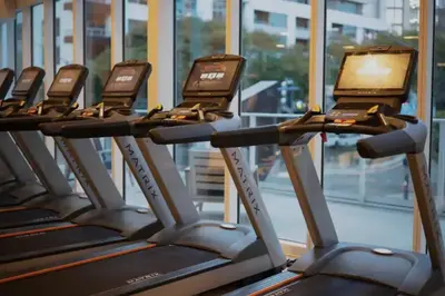 a row of cardio treadmills in a gym at Luxury Designer Suite with Rooftop Pool, Gym in San Diego