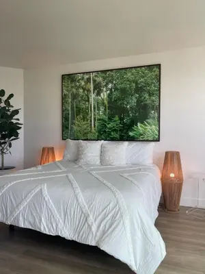 a bedroom with a white bed with a large window at Luxury Designer Suite with Rooftop Pool, Gym in San Diego
