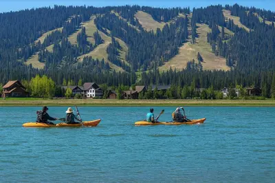 a group of people in kayaks on a lake at Willow brook room with TV in Hemet
