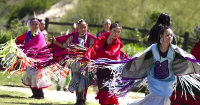 a group of women performing a dance in the grass at Willow brook room with TV in Hemet