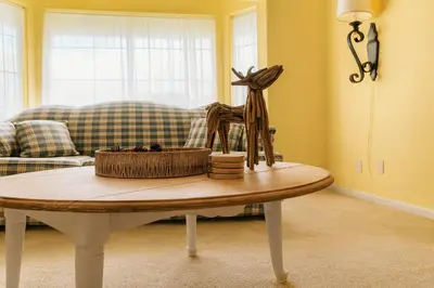 a living room with a table and a couch at Wildflower Haven room in Hemet