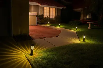 a garden with lights in the grass at night at Wildflower Haven room in Hemet