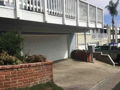 a house with a garage with a bridge over it at Blue Whale Inn San Clemente Retreat Unit E in San Clemente