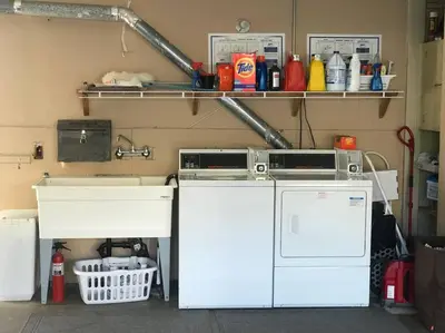 a laundry room with a washer and a sink at Blue Whale Inn Pet and Kid Friendly Unit C in San Clemente