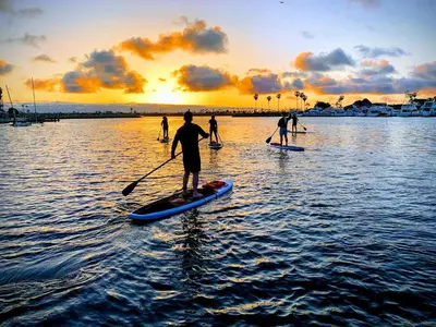 a group of people on paddle boards in the water at Studio Free Parking Walk to Convention in San Diego