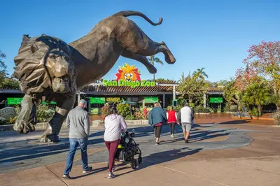 a group of people walking past a statue of a dog at Free Parking Cozy 1BR in Gaslamp Conv Center in San Diego