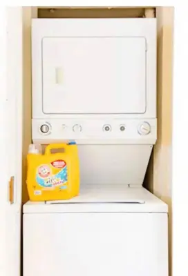a microwave oven sitting on top of a refrigerator at Top Floor Walk to Conv Center Free Parking in San Diego