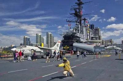 a group of people on a ship with a plane at Top Floor Walk to Conv Center Free Parking in San Diego
