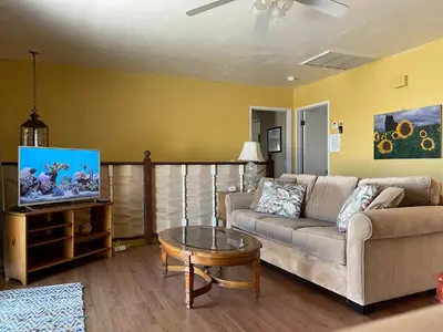 a living room with a couch and a table at House on Organic Farm in Escondido