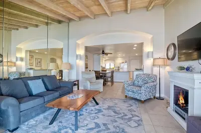 a living room with a couch and a fireplace at Oceanfront Views, Heated Pool, Hot Tubs, Parking in Solana Beach