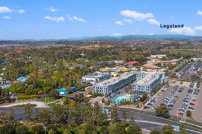 an aerial view of a city with a parking lot at Sunrise by the Sea 1 Block from Ocean in Oceanside