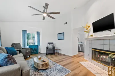 a living room with a couch and a fireplace at Life on the Point in San Diego