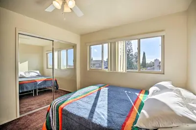 a bedroom with a bed and a window at Breeze By the Pool Chula Vista Home with Game Room in Chula Vista