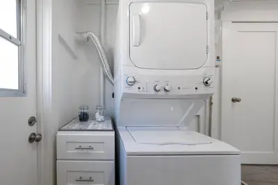 a white bathroom with a sink and a mirror at Charming Hillcrest/Mission Hills 3 BR + House in San Diego