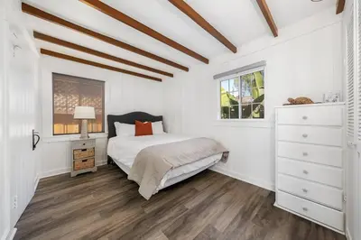 a white bedroom with a bed and a window at Charming Hillcrest/Mission Hills 3 BR + House in San Diego