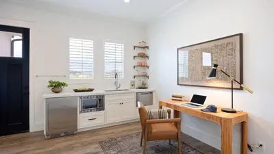 a kitchen with a desk with a laptop on it at Pinot Point by AvantStay Massive Estate 10 mins from Temecula Wineries in Temecula
