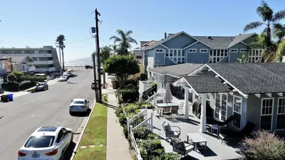a street with houses and cars parked on the street at Remodeled Beach Bungalow, Block to the Beach in Carlsbad