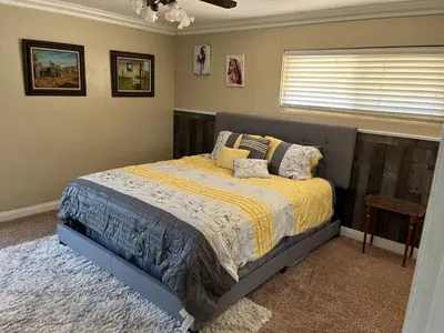 a bedroom with a bed and a window at Peaceful & Cozy 3 bedroom Ranch-Home w/Fireplace in Hemet